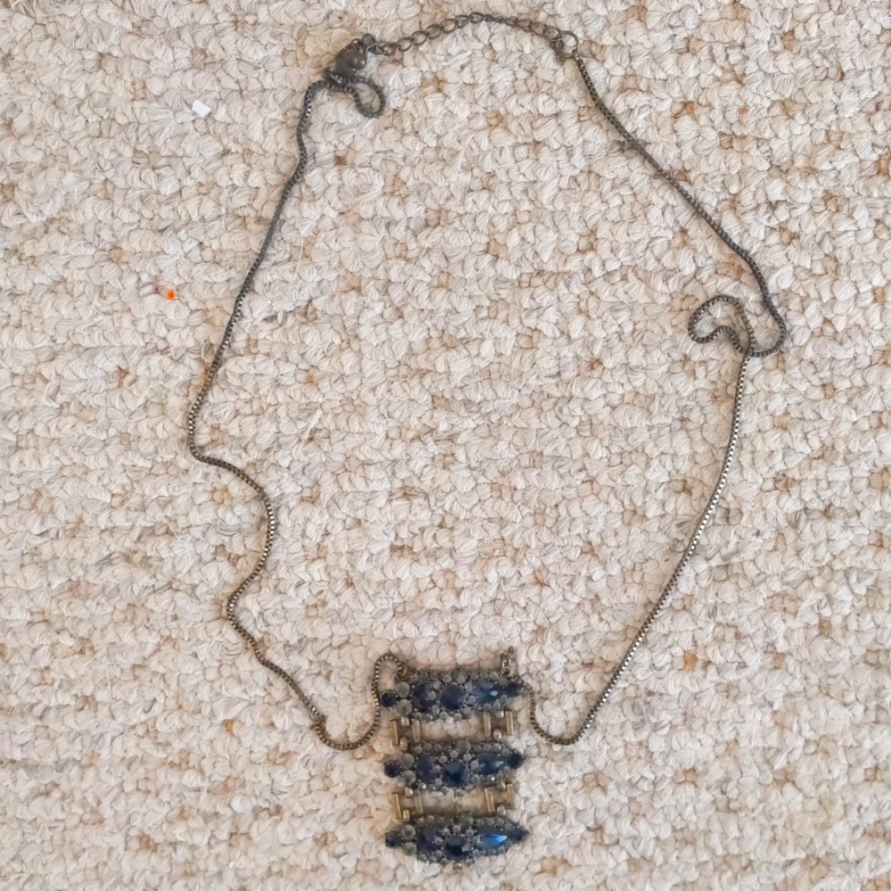 Antique looking deep blue sapphire necklace.